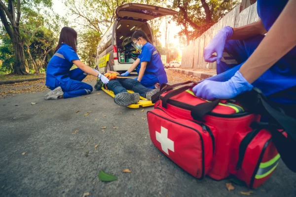 emergency-accident-patient-suffered-head-lying-stretcher-first-aid-training-move-patient-emergency-accident-paramedic-transfer-patient-ambulance-car-select-focus-first-aid-bag