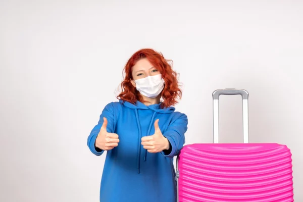 front-view-young-female-with-pink-bag-mask-white-wall